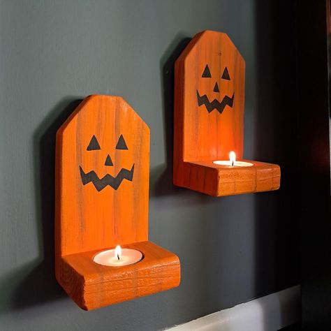 Farmhouse Halloween Cute Jack O Lantern Wood Wall Mounted Tea Light Candle Holders Make your Farmhouse even more Spooky this Halloween with these super cute Rustic Wood Jack O Lantern Teas Light Candle Holders.  These Candle Holders were made using Reclaimed Wood. They were hand painted using Pumpkin Orange Paint and then a Jack O Lantern face was added.  Measuring 3.25 x 6.25 x 2.75, each Candle Holder holds 1 Tea Light Candle. (Included) Hangers were added for easy hanging.  These Wood Candle Wood Jack O Lantern, Diy Repurposed Items, Cute Jack O Lantern, Fall Wood Crafts, Halloween Craft Projects, Tea Light Candle Holders, Halloween Wood Crafts, Wood Craft Projects, Farmhouse Halloween