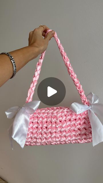 𝓫𝔂𝓰𝓪𝓵𝓴 - crochet patterns for beginners 🎀 on Instagram: "Crocheting with thick satin ribbon yarn to make this gorgeous satin bow handbag inspired by @nina.new.york 🎀 Perfect crochet handbag for a wedding guest 💒 I think I am now addicted to satin ribbon yarn, need to order more! It gives a luxurious touch to your crochet bags #crochet #crochetaddict #crochetersofinstagram #satinbow #crochetbow #bows #ribbons #bowbag #crochethandbag #crochet #slowfashion #slowfashion #knittingbags #knitbag #amigurumi" Crochet With Ribbon Yarn Ideas, How To Make A Bow With Yarn, Crochet Bag Ideas Inspiration, Crochet With Ribbon Yarn, Satin Ribbon Crochet Bag, Crochet Ribbon Bag, Crochet Ribbon Yarn, Ribbon Crochet Pattern, Crochet With Ribbon