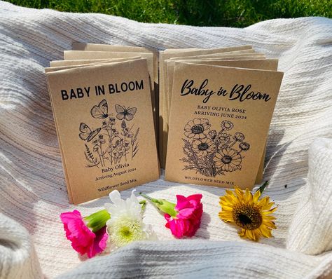 Customizable Seed Packets!  Perfect favor for baby showers to add that final touch.  We use high quality printers and paper during our process.  If you have any questions, don't hesitate to reach out to us! ∙Printed on high quality, eco-friendly kraft paper ∙Envelopes approximately 3.25x4.5 when sealed WITH SEEDS ∙Wildflower seeds sealed in envelopes ∙Wildflower Mix Suitable for all regions of North America ∙Planting directions included inside envelopes with seeds WITHOUT SEEDS ∙Fully printed an Wildflower Seeds Baby Shower Favor, Baby In Bloom Party Favors, Baby Shower Wildflower Theme, Flower Themed Baby Shower Ideas, Wildflower Baby Shower Theme, Bloom Baby Shower Theme, Wild Flower Baby Shower, Seed Envelopes, Flower Baby Shower