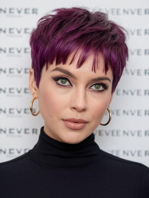 This short pixie cut with deep purple highlights is a bold statement of individuality. The deep plum tones add dimension, giving the hairstyle depth and personality. A friend of mine once rocked a similar look, and it completely transformed their style, making their features pop. The cut works best for those with strong jawlines, as it highlights the face beautifully. To maintain the color’s richness, I’d recommend using a purple shampoo—it prevents brassiness and keeps the hue vibrant longer. This style fits right into the spring hair color trends short hair ideas 2025. Fun Hair Color For Pixie Haircut, Short Hair Purple Highlights, Deep Purple Highlights, Hair Color Trends Short Hair, Short Coloured Hair, Winter Short Hair, Hair Trends Color, Pixie Haircut Color, Pixie Cut Color