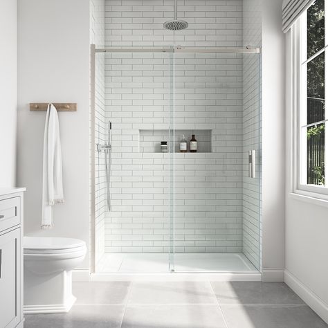 The minimalist design of the Davidson sliding shower door combines a beautiful frameless construction with a smooth streamlined rolling system, making it a must-have feature for any bathroom upgrade. It opens and closes with a sliding movement, aided by an aluminum top bar, 1-1/2-in diameter rollers, and double-sided door handles. It includes 1/4-in (6mm) thick tempered clear glass panels for added reinforcement. The double-sided, easy-clean, shower door is available in widths of 48-in and 60-in Chrome Shower Door, Chrome Towel Bar, Frameless Sliding Shower Doors, Bathtub Doors, Allen Roth, Double Sink Bathroom, Shower Surround, Double Sink Bathroom Vanity, Sliding Shower Door