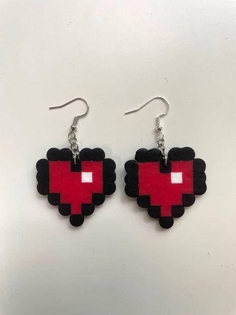 Made-to-order Perler Heart bead earrings. Each earring is made with silver earring hooks that are nickel free. These earrings are lightweight and fun to wear. Pixel Art Jewellery, Perler Earrings Diy, Small Easy Perler Bead Patterns, Perler Beads Earrings Ideas, Hama Bead Earrings, Perler Bead Ideas Small, Easy Small Perler Bead Ideas, Small Perler Beads, Perler Heart