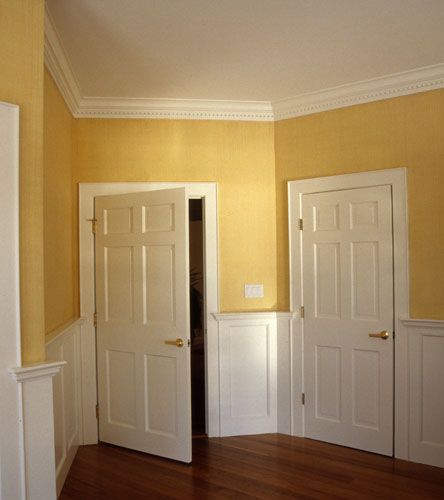 Exactly what I don't want.  The yellow's too dark--borders on that brown from the WEHO place. Wainscoting Colors, Yellow Hallway, Hall Wall Decor, Wainscoting Living Room, White Baseboards, Wall Molding Design, Baseboard Styles, White Wall Paneling, Yellow Dining Room