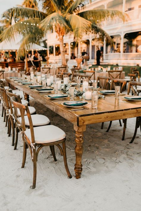 wedding ceremony setup with long wooden roman tables Florida Keys Wedding Venues, Aruba Weddings, Destination Wedding Cost, Beach Wedding Tables, Tropical Glam, Florida Keys Wedding, Beachy Wedding, Key West Wedding, Destin Florida Wedding