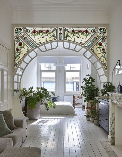 Bedroom, Bed, Pendant Lighting, and Painted Wood Floor "I like lamps with opal white and brass elements," Taeyman adds, who used lamps of different heights throughout the space. Photo 9 of 12 in An Antwerp Apartment Captures the Spirit of the Belle Époque زجاج ملون, Foyer Design, Diy Interior, House Goals, A Living Room, Architectural Digest, Design Case, My New Room, House Inspo