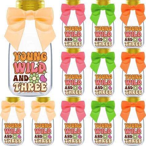 PRICES MAY VARY. INCLUDES: 12 Plastic Bottles, Gold Caps, Ribbons, Young Wild and Three Stickers, and Thank You Stickers. Each bottle measures 4.00 x 1.80 inches and holds 4 ounces, perfect for creating groovy party favors FUNKY - Transport back to the 60s and 70s with these candy jars. These bottles not only complements the retro vibe, but also adds an extra dose of hip to your keepsakes, ensuring your guests leave happy EASY SETUP - Get the party flowing in seconds! Simply fill them with treat Wild And Three Party, Young Wild And Three, Groovy Party, Diy Party Favors, Retro Table, Favors Diy, Gold Caps, Diy Candy, Thank You Stickers