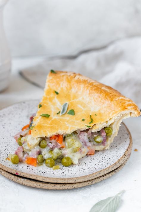 Ham Pot Pie is a cozy and comforting way to use up your leftover ham from the holidays! The ham and veggies are cooked in a creamy sauce and baked in a buttery, flaky homemade pie crust. #hampotpie #leftoverham #leftoverhamrecipes #potpie #homemadepotpie #krollskorner #comfortfood #recipes Potato Pot Pie, Ham Pot Pie, Homemade Pot Pie, Pie Crust Shield, Pot Pie Recipes, Pot Pie Filling, Ham Casserole, Leftover Ham Recipes, Homemade Pie Crust