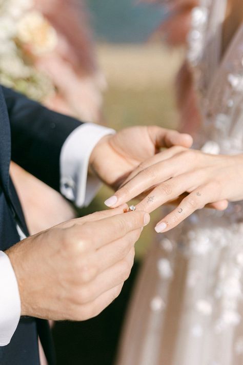 It's the tiny things that kiss and tell the big stories... Unfolding the value and beauty of capturing moments and memories has become my second nature. After all, it feels like time smiles back at us when given the ability to capture these moments, allowing us to revisit and relive them in the future. Photography: @fiorello Planning & Styling: @5th_muse Videography: @lulumeli_com Floral design: @filanthi_floral_design Stationery: @meili.fluous Wedding dress: @madebride Groom’s attire: @gia... Self Foto, Exchanging Rings, Vacation In Italy, Wedding Toss, Paris Couple, Ring Photography, Wedding Background Decoration, Romantic Wedding Inspiration, Deeply In Love