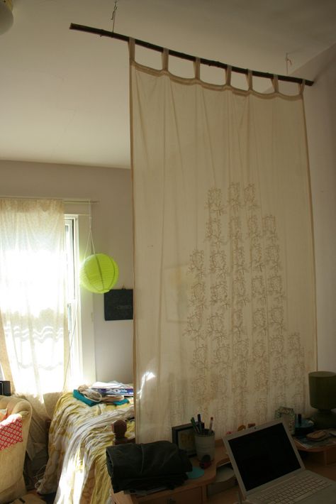 I used a sturdy branch to hang a sheer curtain dividing my desk and bed. Nothing fancy, just some eye hooks in the ceiling and colored thread holding up the branch. (Excuse my mess!) Chinese Room Divider, Room Divider Headboard, Small Room Divider, Temporary Room Dividers, Office Room Dividers, Fabric Room Dividers, Portable Room Dividers, Glass Room Divider, Bamboo Room Divider