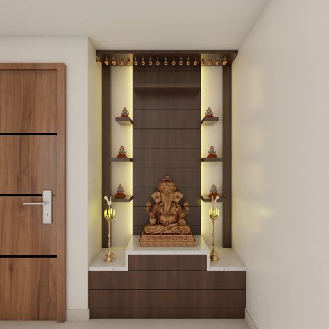 Embrace modern elegance with a 5x2x9 feet Acacia Exodus floor-mounted pooja unit. Its open-door design conceals drawers for seamless storage. The backdrop features a wooden wall panel illuminated by LED lighting, creating a serene atmosphere. Adding functionality, open racks provide a dedicated space for displaying idols, harmonizing style with practicality in your sacred enclave. Pooja Unit Designs Modern, Wooden Pooja Room, Pooja Room Interior, Low Floor Bed, Puja Unit, Pooja Unit, Mandir Design, Temple Design For Home, Latest Interior Design