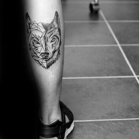 Back Of Leg Calf Man With Tattoo Of Geometric Wolf Geometric Wolf Tattoo, Wolf Tattoos Men, Tattoo Wolf, Armband Tattoos, Key Tattoo, Geometric Wolf, Maori Tattoo Designs, Wolf Tattoo Design, Tattoo Bracelet