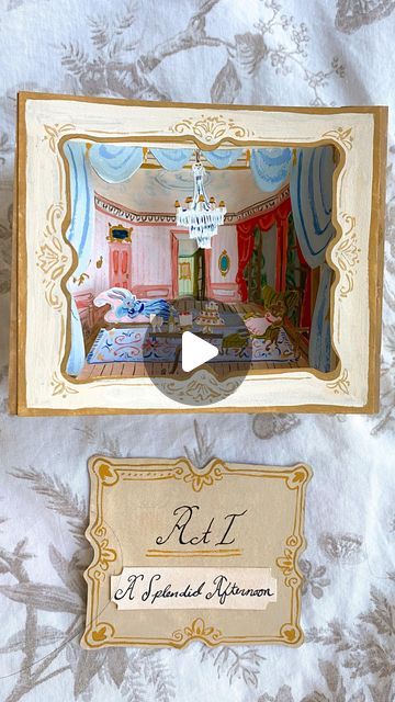 Alley McGlynn on Instagram: "Paper theaters are a form of miniature paper art dating back to the Victorian era. They were often sold as DIY souvenir kits from the concession stands at a live opera or theater. Can you imagine being able to take home a kit to build a miniature scene from your favorite movie after seeing it at the cinema? So fun!   In this Act, (A Splendid Afternoon), we join Beatrice and Madeline lounging in the grand salon among a tower of cream puffs, raspberry soufflé and glasses of plumberry champagne. 🍰🥂  If you’ve seen the tunnel book tutorial in my previous reels, the construction for the paper theater is exactly the same! ✂️  #illustrator #illustration #paperartist #paperart#3dpaperart #tinyworlds #miniatures #miniatureworld #tunnelbook #papertheater" Diy Tunnel Book, Tunnel Book Tutorial, Tunnel Books, Diy Souvenirs, Culture Vulture, Paper Theater, Concession Stands, Art Content, Tunnel Book