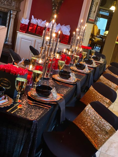 Black,gold and red dinner oartt table decor Red Black And White Dinner Decor, Red Black Gold Table Settings, Black And Red Dinner Table, Black Gold Dinner Table, Red Black And Gold Event Decor, Red Black And Gold 60th Birthday Party, Red Black And Gold 18th Birthday, Red Black And Gold Dinner Party, Black Gold Red Table Setting