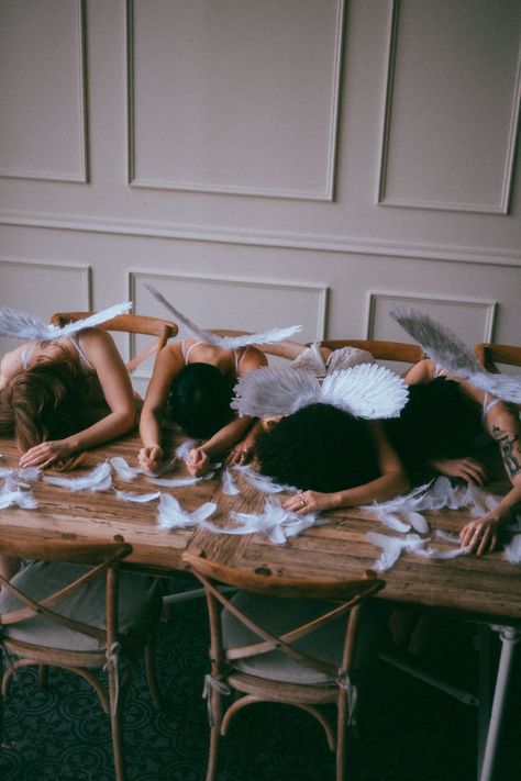 four angels with their heads down on a wooden table. valentine’s day dreamy cherub vibes Cherub Photoshoot, Cupid Photoshoot Women, Cupid Photoshoot, Angel Photoshoot, My Friend Group, Valentines 2024, Valentines Day Photoshoot, Cupid And Psyche, Friend Group