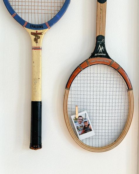 Old tennis rackets were on my 2024 thrift goals list, so ☑️ Also, added a cute lil picture of Zack and I playing tennis. We don’t actually know how to play, and we follow a very loose set of rules, but man — we have fun. ✨ vintage decor, thrifted tennis rackets, Polaroid, @fujifilm_instax_northamerica Tennis Racket Art Wall Decor, Old Rackets Decor, Old Tennis Racket Decor, Tennis Racket Wall Decor, Vintage Tennis Racket Decor, Vintage Tennis Aesthetic, Tennis Racquet Decor, Thrifted Room Decor, Tennis Bedroom