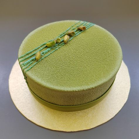 Pistachio sponge layered with mascarpone cream mousse and velvet coating. Decorated with pistachios and matcha chocolate wrap. Pistachio Entremet, Matcha Chocolate, Mascarpone Cream, Chocolate Wrapping, Green Cake, Pistachio Cake, Colorful Cakes, Sponge Cake, Cake Decoration