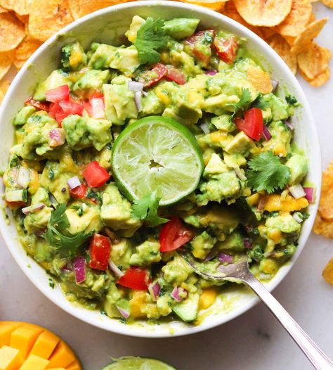 Sweet, juicy mangos, spicy jalapeño, creamy avocado, and bright lime juice are just some of the ingredients that make this Whole30 and Vegan Mango Guacamole recipe something truly special. It's always a crowd pleasing dip to serve with your favorite tortilla or plantain chips, or on top of any Mexican-inspired dish! #cookathomemom #whole30recipes #guacamole #avocado Mango Guacamole Recipe, Mango Guacamole, Whole30 Vegan, Creamy Avocado Sauce, Avocado Vegan, Healthy Appetizer Recipes, Plantain Chips, Wellness Recipes, Guacamole Recipe