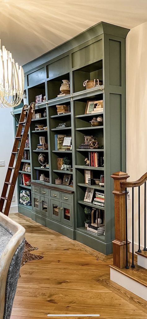 Library Wall In Dining Room, Built In Bookcase High Ceiling, Sloped Ceiling Library, Vaulted Ceiling Shelving, Built In Shelves With Ladder, Stairs With Bookshelves, English Home Library, Stained Bookshelves, Landing Bookcase