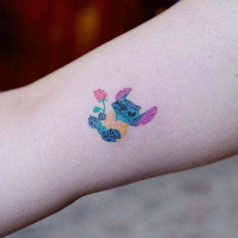 Lilo and Stitch tattoo inspo by South Korean tattoo artist @nandostudios. Click the link for more tattoos inspired by the wonderful world of Disney 🏰 #disneytattoo #tattooinspiration #tattoos #tattoo #liloandstitch  #liloandstitchtattoo #colortattoo #armtattoo #biceptattoo #tinytattoo #smalltattoo South Korean Tattoo, Lilo And Stitch Tattoo, Fandom Tattoos, Belle Tattoo, Skull Tattoo Flowers, Wonderful World Of Disney, Korean Tattoo, Korean Tattoo Artist, Stitch Tattoo