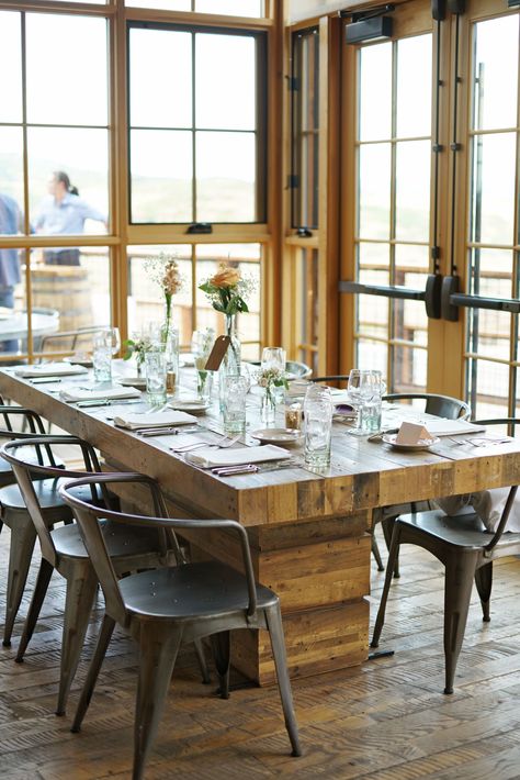 Rustic-Industrial Wood Dining Tables and Pilot Chairs Industrial Wood Dining Table, Cafe Architecture, Industrial Farmhouse Living Room, Rustic Romantic Wedding, High West Distillery, Wood Dining Tables, Dining Room Industrial, Industrial Cafe, Industrial Wall Decor