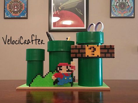 Perler Bead Mario Desk Organizer. Nostalgia makes work so much easier to deal with! Mario Block, Video Game Crafts, Mario Crafts, Perler Bead Mario, Pipe Desk, Geeky Craft, New Challenger, Plastic Bottle Flowers, Art Perle