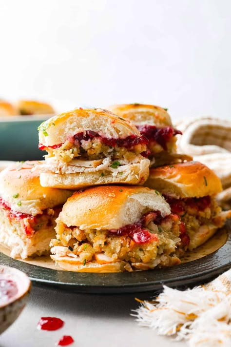 All the best things about Thanksgiving in slider form! These turkey cranberry sliders are warm and buttery, made with Hawaiian rolls packed full of turkey, stuffing, and cranberry sauce for the perfect balance of sweet and savory. A must-make with holiday leftovers! Turkey Skewer Appetizers, Cranberry Turkey Sliders On Hawaiian Rolls, Thanksgiving Stuffed Turkey Recipes, Thanksgiving Pinwheel Appetizers, Turkey Stuffing Cranberry Sliders, Thanksgiving Sliders Recipes, Turkey And Stuffing Sliders, Turkey Stuffing Sliders, Thanksgiving Luncheon Ideas