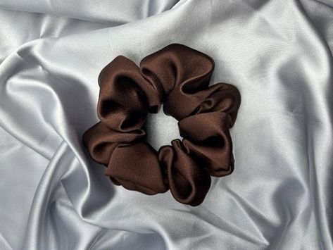 Elevate your hairstyles with our Silk Scrunchies! Adds the perfect touch to any look while maintaining the health of your hair! Our Scrunchies are the perfect gift for bridesmaids, moms, sisters...anyone! Brown Silk Scrunchie, Brown Scrunchie, Wedding Gate, Gift For Bridesmaids, Silk Scrunchies, Low Bun, Brown Silk, Green Silk, Bun Hairstyles