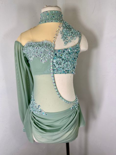 Sage green beaded applique dance costume with preciosa or swarovski crystal ab rhinestones Ready to ship in size Small Adult In production in size LC and one more size… can be made then the fabrics/ materials have been discontinued im sage but then could be ordered in another color.. with your measurements ready to ship in size SA or can be custom ordered in another color size with your measurements Please be sure to add your measurements and date needed by and any other adjustments or notes to the notes section of your order at checkout Green Dance Costume, Lyrical Dance Costumes Solo, Solo Dance Costumes, Twirling Costumes, Pretty Dance Costumes, Tap Costumes, Custom Dance Costumes, Dance Competition Costumes, Dance Costumes Lyrical