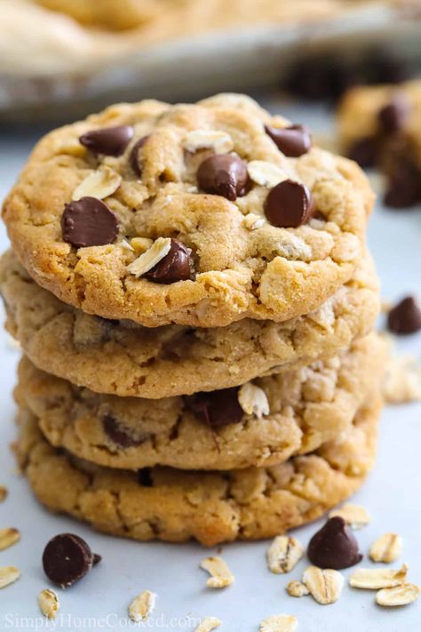 These Chewy Peanut Butter Oatmeal Cookies are so amazing, you're going to want to make a double batch! Soft and sweet with gooey chocolate chips and amazing chew, they are simply scrumptious. #peanutbutteroatmealcookies #chewypeanutbutteroatmealcookies #peanutbutteroatmealcookiesrecipe #chewypeanutbutteroatmealcookiesrecipe Chewy Peanut Butter Oatmeal Cookies, Peanut Butter Oatmeal Chocolate Chip, Butter Oatmeal Cookies, Cookie Recipes Chewy, Monthly Menu, Nut Bars, Buttery Shortbread Cookies, Fabulous Cakes, Peanut Butter Oatmeal Cookies