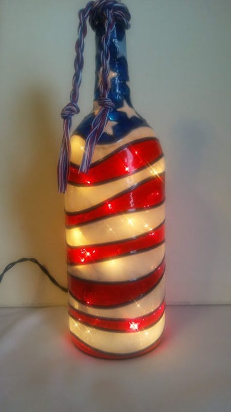 This Hand painted Wine Bottle features an American Flag . Wine Bottle has a stained Glass look.. The Bottle is lighted with a string of 35 craft lights. I paint these Bottles by Hand and have many different designs. This is a 1.5 Liter Bottle. This will make a great Gift for someone else or for you self. Great House warming Gift. Odd Decor, Bottle Upcycle, Lighted Bottles, Glitter Bottles, Bottle Projects, Crafts Recycled, Painted Glass Bottles, Wine Bottle Lamp, Hand Painted Wine Bottles