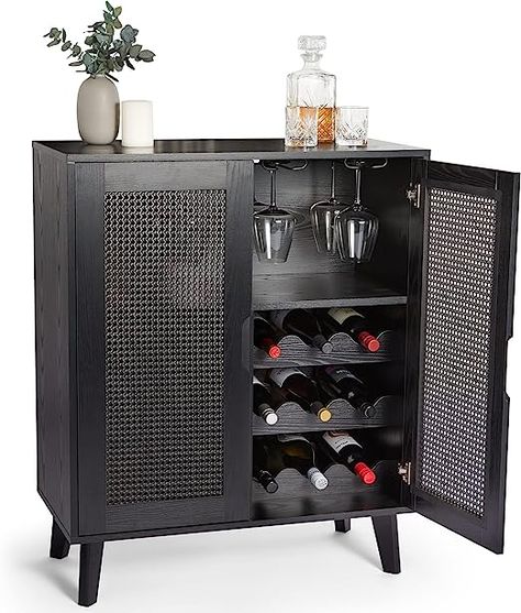 Combining retro inspired rattan and wood-effect detailing, this bar cabinet is finished in deep black for a distinctive new home for your drinks collection.
 Keep up to 9 wine bottles on the bottle rack, hang up to 12 wine glasses with the 4 hanging rails, and store bottle openers & more in the convenient drawer. Wine Sideboard, Glass Rails, Wrought Iron Wine Rack, Iron Wine Rack, Wine Glass Storage, Drink Storage, Sideboard Drinks Cabinet, Black Rattan, Wine Rack Cabinet