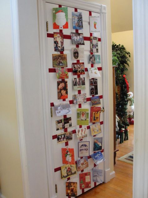 I created a Christmas card wall by taping red velvet ribbon to a closet door in my foyer.  I bought decorative paper clips to attach the cards to the ribbon.  Love it! Hanging Christmas Cards, Holiday Card Display, Christmas Stairs Decorations, Valentine Wreath Diy, Christmas Card Display, Creative Prompts, Diy Valentine, Card Display, Christmas 2017