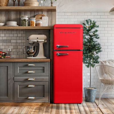 The Frigidaire Retro Refrigerator seamlessly blends retro aesthetics with modern convenience thanks to its sleek stainless steel finish, classic chrome trim, and vintage-inspired pull handles. Stylish and functional, this small fridge freezer comes with ample storage including three adjustable, slide-out glass shelves, a transparent vegetable crisper, and four clear door shelves. Frigidaire Color/Finish: Red | Frigidaire 7.5 Cu. Ft. Capacity Retro Fridge Freezer Combo, Upright Fridge Freezer Com Small Fridge Freezer, Red Kitchen Appliances, Red Fridge, Red Refrigerator, Two Door Refrigerator, Apartment Size Refrigerator, Clear Door, Retro Fridge Freezer, Vintage Fridge