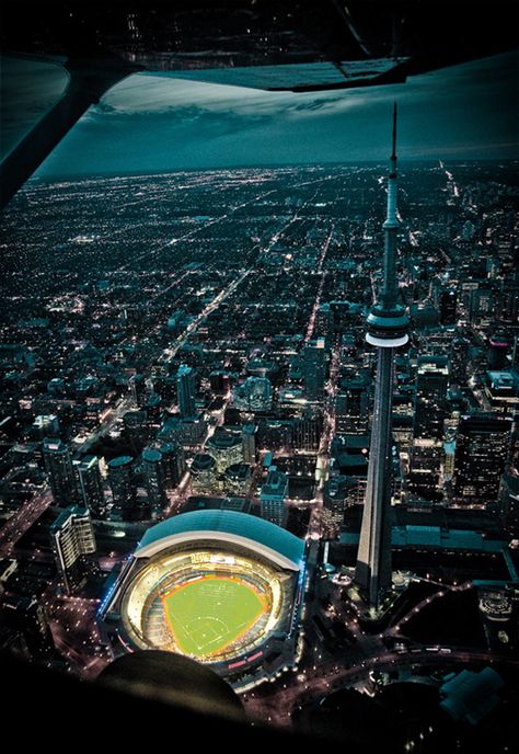 Amazing aerial view of the sky dome and CN Tower #toronto  One of our "Pre-kids" vacations !!  Watch a game in the sky dome and stayed over night there afterwards Visit Toronto, Lights At Night, City Lights At Night, Toronto Skyline, Toronto City, City At Night, O Canada, Baseball Stadium, Of Montreal