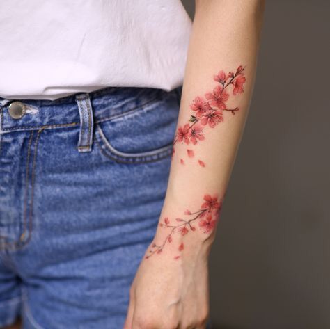 Cherry blossoms represent the frail, delicate, ephemeral quality of our existence. However, they are also a reminder that even though life may be short and transitory, to perceive the beauty in it is enough reason to live. Wrap Around Wrist Tattoos, Around Arm Tattoo, Wrap Around Tattoo, Wrap Tattoo, Studio Tattoo, Vine Tattoos, Inspiration Tattoos, Blossom Tattoo, Cherry Blossom Tattoo