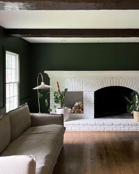 White Brick Living Room Fireplace With Greenery - Soul & Lane White Brick Living Room, White Painted Fireplace, Brick Fireplace Wall, Neutral Couch, Living Room Upstairs, Black Mantle, Dark Green Living Room, Brick Living Room, White Brick Fireplace