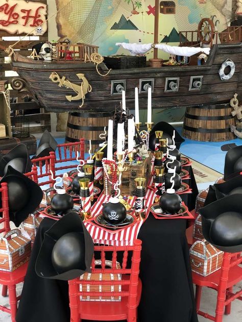 Jacobs Pirate party  | CatchMyParty.com Pirate Party Ideas Decorating, Jack Sparrow Birthday Party, Pirate Themed 1st Birthday Party, Kids Pirate Birthday Party, A Pirates Life Four Me Party, Pirate Balloon Garland, Pirate First Birthday Party, Pirate Centerpiece Ideas, Pirates Of The Caribbean Birthday Party