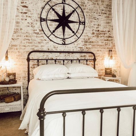 I am loving the black metal accents like the bed frame, and compass! I think that the contrast they provide from the distressed brick wall… Black Metal Bed Frame Bedroom, Brick Wall Bedroom Ideas, Metal Bed Frame Bedroom Ideas, Metal Bed Frame Bedroom, Distressed Brick Wall, Brick Wall Bedroom, Farmhouse Guest Bedroom, Black Metal Bed Frame, Black Metal Bed