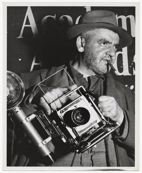 Weegee the Famous and his Speed Graphic camera, standing in front of a sign for the Academy Awards.  Unidentified Photographer, Los Angeles, 1951 Speed Graphic Camera, Large Format Camera, Photographer Camera, Academy Awards, A Sign, Historical Figures, Angeles, Instagram Photos, Black And White