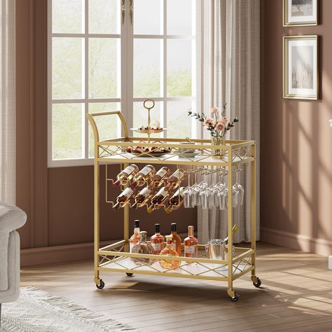 PRICES MAY VARY. Luxurious Appearance Design: Golden metal frame gives the gold bar cart with wheels a noble appearance. The 2-layer storage design meets basic storage needs and makes the entire bar cart look simple and practical. It is not only a bar cart, but also a dazzling decoration. Storage Design: two levels of storage space, dimensions 31.5” long x 15.3” wide x 36.2” high, Whether you are putting wine, wine glasses, or various snacks, it can easily do the job. Not only that, it also has Bar Cart Glasses, Bar Cart Ideas For Home, Home Bar Carts, Glass Bar Shelves, Wine Rack Glass Holder, Rolling Bar Cart, Decoration Storage, Gold Bar Cart, Fruit Plates