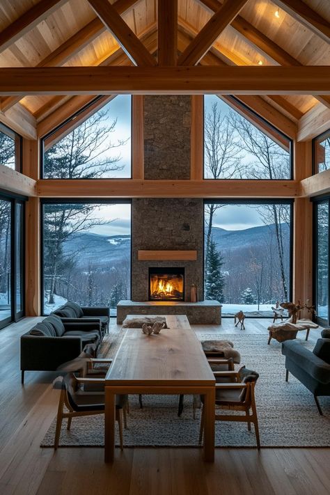 Modern Timber Frame Home With a Central Stone Fireplace and Open plan Design stunning winter mountain view through the windows. Check out and drool over all of these enchanting mountain homes with stone fireplaces–the ultimate cozy and rustic retreats. Mountain Stone House, Home Mountain View, Mountain Home Aesthetic, Cozy Mountain Home, Modern Timber Frame Homes, Open Plan Design, Modern Timber Frame, Architecture References, Sustainable House Design