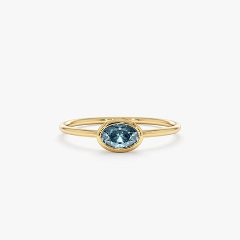 Every piece is a dazzling beauty. Topaz is the birthstone of December and is a symbol of love and affection. Wear it for yourself, or gift this dainty 14k gold ring to someone you love. Total Blue Topaz Carat Weight: 0.45 ctw Setting Size: 7 x 5 mm All pieces come beautifully boxed in suede pouches you can always use. Memory Ring, Dainty Gold Ring, Solid Gold Bracelet, Dainty Gold Rings, Gold Rings Stackable, Solid Gold Necklace, Name Jewelry, Solid Gold Rings, Rose Yellow