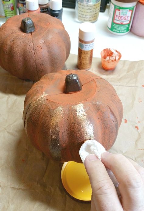 dab-on-the-gold-paint-using-a-paper-towel How To Paint Foam Pumpkins, Foam Pumpkin Ideas, Dollar Tree Styrofoam Pumpkins, Styrofoam Pumpkin Crafts, How To Paint Styrofoam, Styrofoam Pumpkins, Pumpkin Makeover, Pumpkins Preschool, How To Make Foam