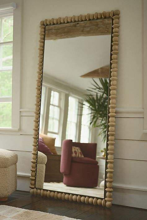 Trimmed with sculptural forms crafted of tropical hardwood, this mirror is perfectly at home in a living room, bedroom, or dressing room. Cover Up Large Mirror, Elegant Floor Mirrors, Boho Mirror Entryway, Oversized Round Floor Mirror, Mcm Large Mirror, Serena And Lily Ojai Mirror, Gold Bohemian Mirror, Unique Bedroom Mirrors, Howbto Frame Mirror