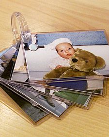 laminated photos bound with shower ring. babies love photos. its a good way for them to recognize family members who live far away too. Pictures Of Family, Flip Photo, Money Saving Ideas, Picture Storage, Martha Stewart Crafts, Baby Proofing, Red Kitchen, Saving Ideas, Science Experiments Kids