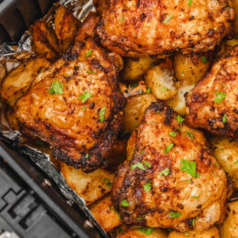 Air Fryer Chicken Thighs And Potatoes - The Dinner Bite Chicken Potatoes Air Fryer, Airfryer Chicken And Potatoes, Air Fryer Chicken And Potatoes, Chicken Thighs And Potatoes, Air Fryer Chicken Thighs, Bone In Chicken Thighs, Golden Chicken, Fry Chicken, Chicken And Potatoes