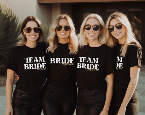 Team Bride TShirt/EVJF JGA T Shirts/Bachelorette Party Shirts Custom/Group Hen Tee Shirt/Addio Al Nubilato/Gift for Bride/Team Bride Gifts for Bridesmaids BUY 3 SHIRTS -> GET 40% OFF 40% discount will automatically be reduced when you add 3 or more T-shirts to your cart. T-SHIRT DESCRIPTION: Our Tees are printed with Flex heat transfer technique which results with high quality performance such as print stretch without crushes and effective retained color that does not fade. Designs are printed on quality and soft T-Shirts. *Sleeves on pictures is rolled up for style example, they are not stitched! They can easily be rolled or relaxed in the way you like. Fabric composition for individual T-Shirt color: - Black T-shirt (100% cotton) - White T-shirt (100% cotton) Print color: - Quality and e Bachelorette T Shirts, Bride Team, Bride Tshirt, Team Bride Shirts, Bachelorette Tshirts, Fade Designs, Gift For Bride, Bride Shirts, Bachelorette Party Shirts