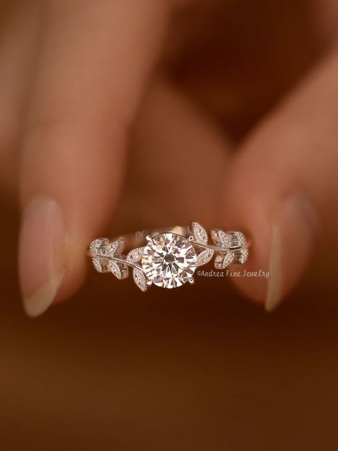 ◆Ring specs: 1: Metal Type: 14K Yellow Gold, 14K White Gold, 14K Rose Gold 2: Main Stone ⁃ Center Stone: Moissanite ⁃ Carat: 1.0 Carats ⁃ Shape: Round Brilliant Cut 3: Side Stones: Diamonds or Moissanites (Please select from the drop down menu) < Diamonds ⁃ Natural and conflict-free diamonds ⁃ Carat: - ⁃ Color: G-H ⁃ Clarity: SI-VS < Moissanites ⁃ Carat: - ⁃ Color: D-F ⁃ Clarity: VVS1 Also available in other colored gemstones upon request. Please get in touch with us! Production time Our jewelry is purely handmade, every production detail, we pay close attention to, every step of the production process, we will follow closely, our materials are ethical diamonds, gemstones and materials, please allow 2-3 weeks for production time, thank you! If you receive your customized jewelry, please be Heart Shaped Promise Ring, Laurel Leaf Engagement Ring, Flower Shaped Wedding Ring, Rings Engagement Flower, Harry Potter Inspired Wedding Rings, Garden Engagement Ring, Engagement Rings Special, Wedding Rings Vine, Wedding Ring With Leaves