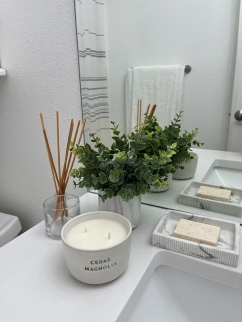 A plant can make a small bathroom feel a little larger and more sophisticated Bathroom Sink Plants, Flowers In Bathroom Decor, Small Bathroom Plant Ideas, Small Plants For Bathroom, Bathroom Flowers Decoration, Small Bathroom Sink Decor, Decorate Bathroom Ideas, Plant Bathroom Aesthetic, Plant In Bathroom