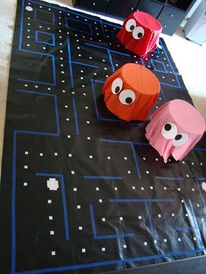 I graduated in the 80's, so I totally appreciate these party decorations! It's an 80s-themed birthday party! I would totally host a party like this and make these decorations! I love the pac-man game! 80s Centerpieces, Flowerless Centerpieces, 80s Decorations, Pac Man Party, 80s Dance, 80's Prom, 80s Party Decorations, 80's Theme, 80s Birthday Parties